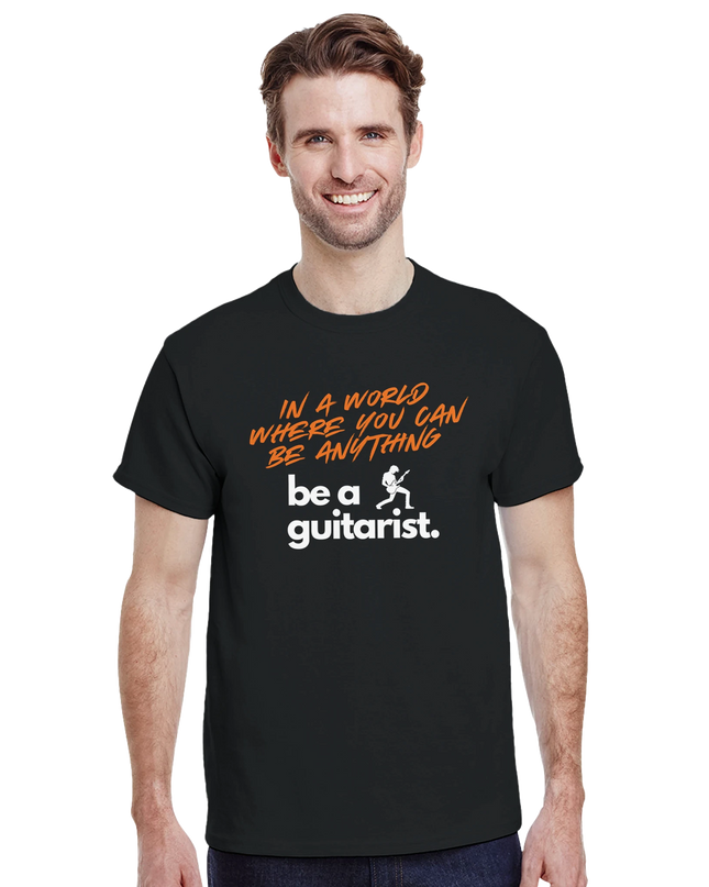 Model wearing the tee styled with guitar and jeans for a casual look