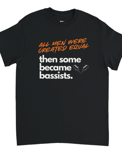 Lifestyle shot: tee draped over amp with bass guitar in background