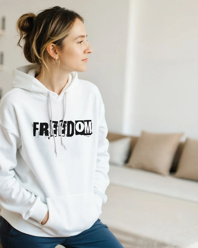 \Flat‑lay of Freedom classic pullover hoodie with vinyl and headphones
