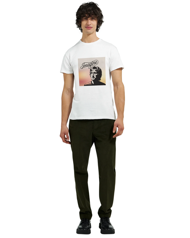 Studio shot of the Imagine T‑Shirt with soft lighting and music notes props”