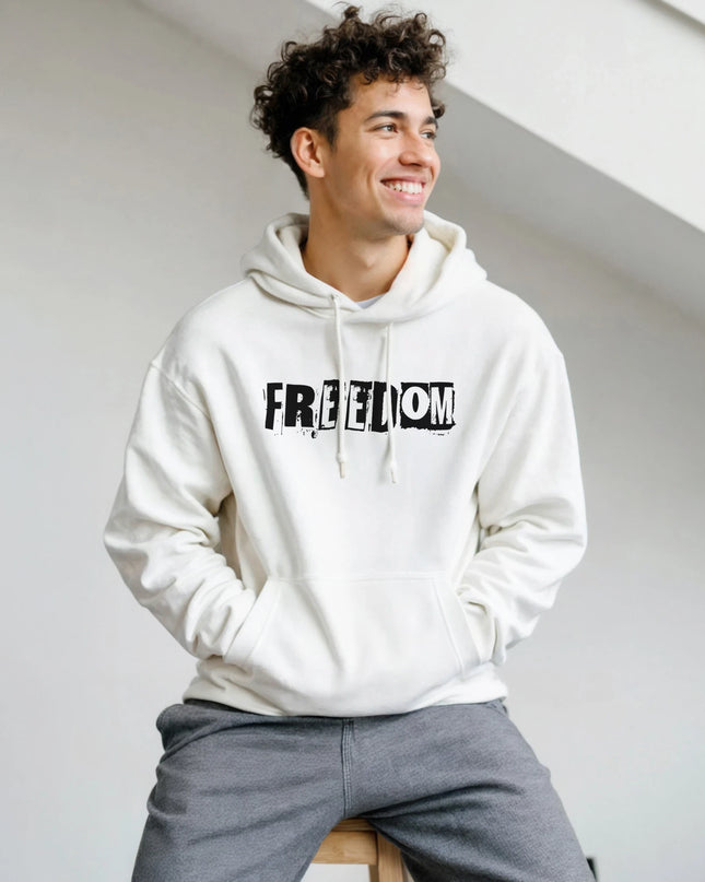 Flat‑lay of Freedom classic pullover hoodie with vinyl and headphones