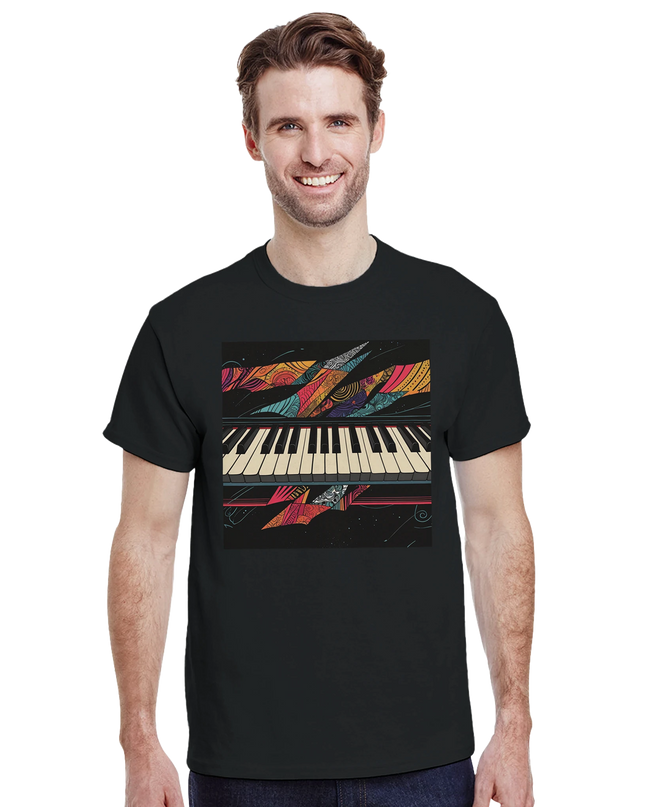 Flat‑lay of shirt with piano keys graphic alongside sheet music and headphones
