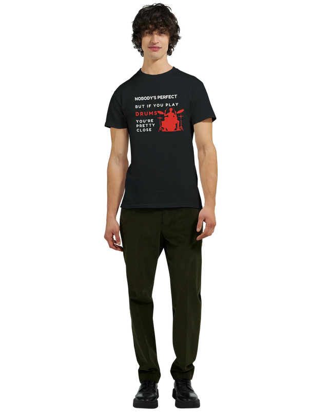 Model wearing drumming humor tee, holding drumsticks on stage