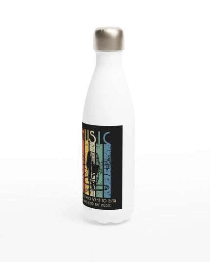 Lifestyle shot: Sing bottle on a desk among music gear and earbuds