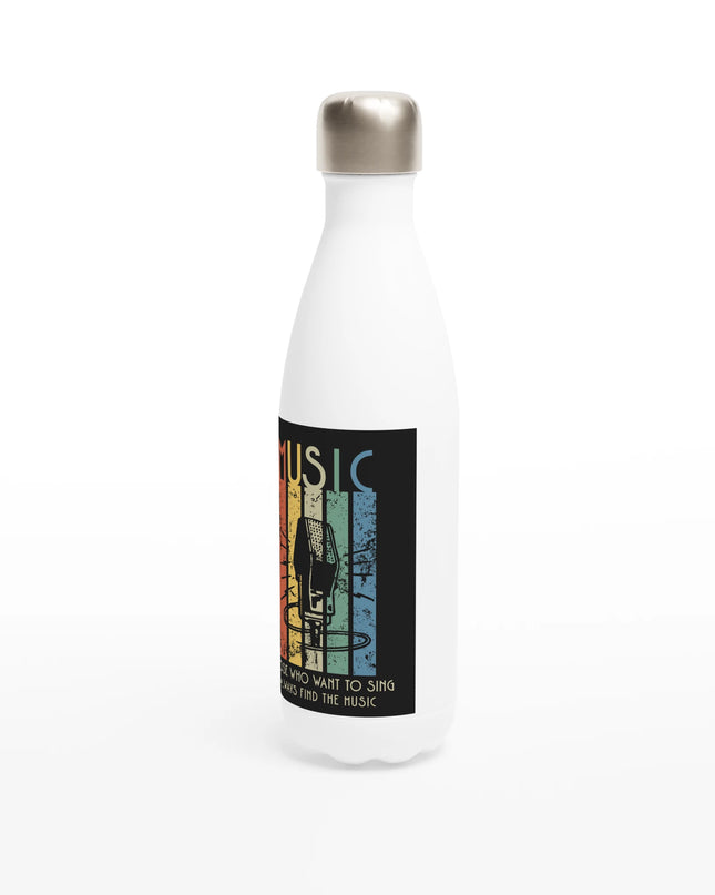 Lifestyle shot: Sing bottle on a desk among music gear and earbuds