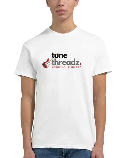 Flat-lay of music-themed T‑shirt with vinyl and notebook props