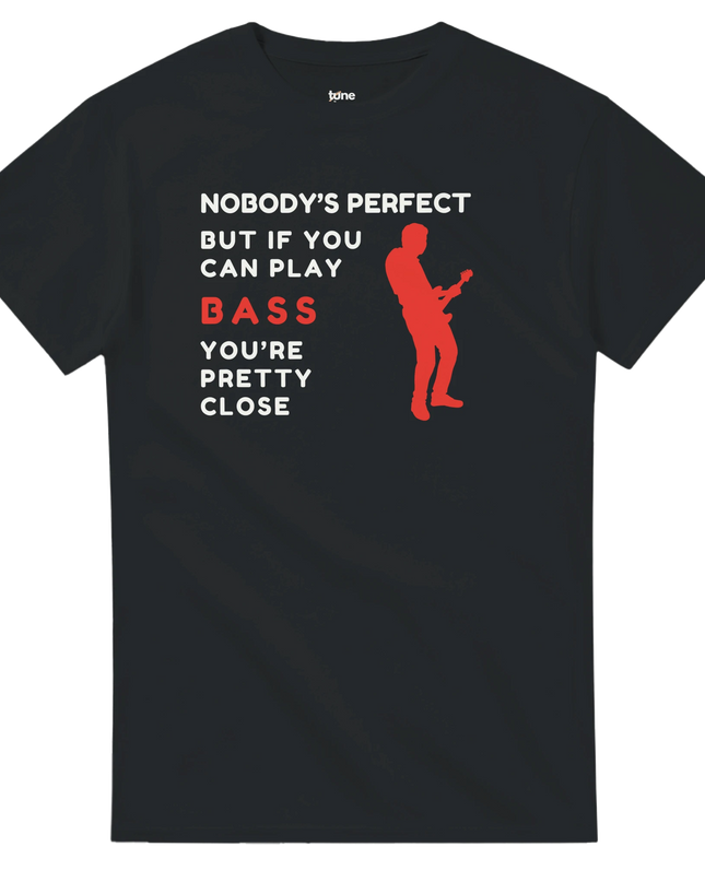 Model wearing Nobody’s Perfect Bass tee styled with bass guitar and stage light