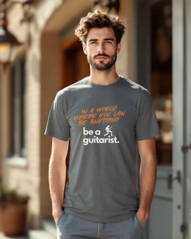 Model wearing the tee styled with guitar and jeans for a casual look