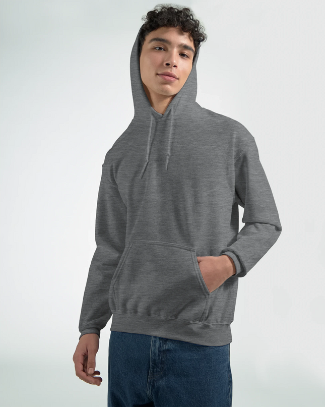 Model in music studio wearing roadie hoodie while adjusting guitar amp cables.