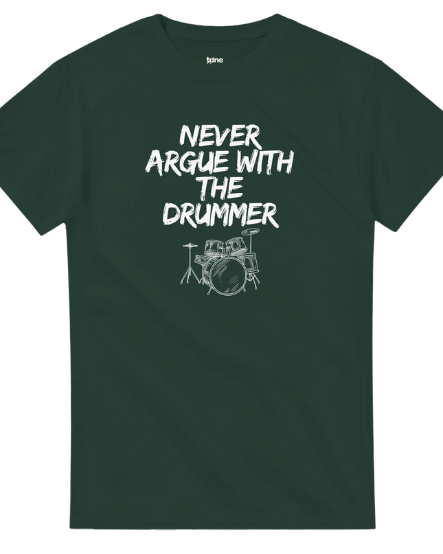 Casual lifestyle shot: tee on a chair beside a drum kit in the background