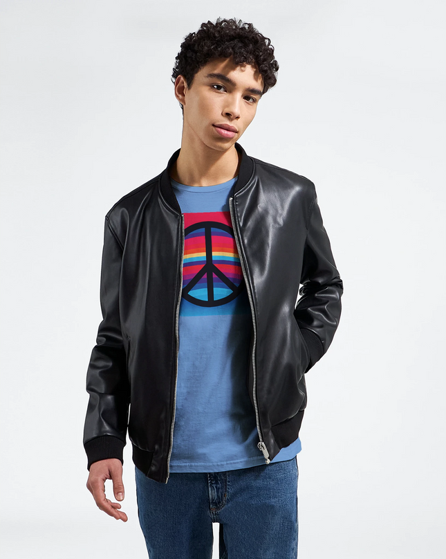 Close-up of vintage style peace symbol on T‑shirt