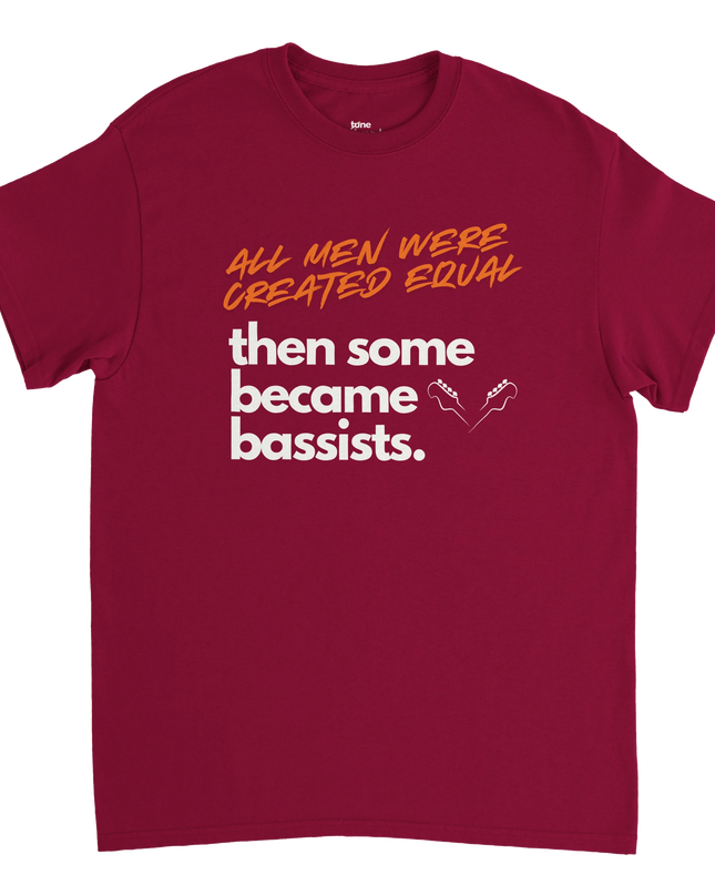 Model wearing the bassist tee with bass guitar strapped and playing
 casually