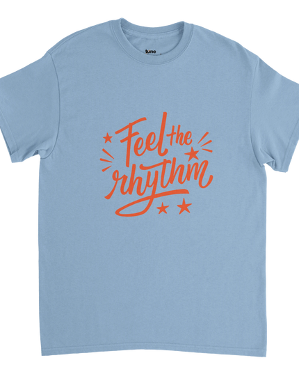Flat-lay of Feel the Rhythm music tee beside turntable and sheet music