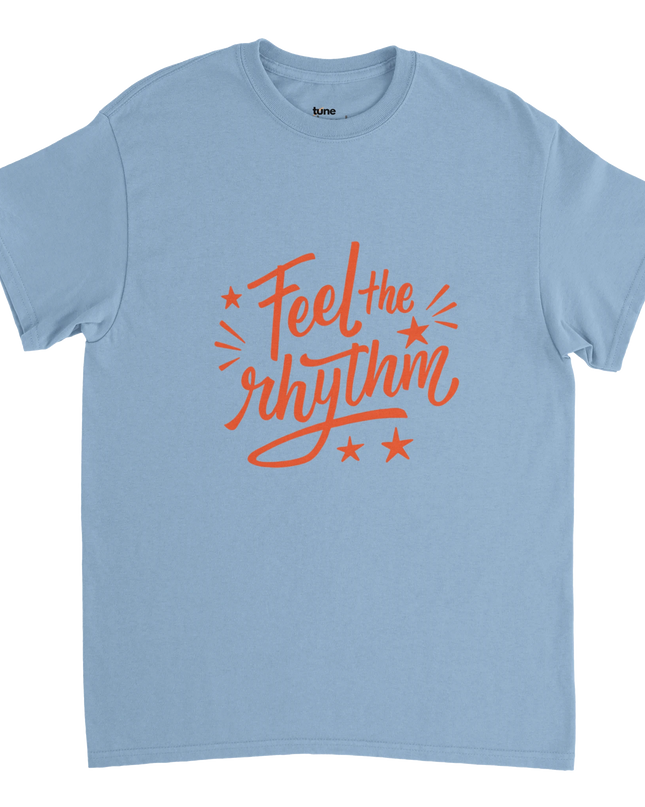 Flat-lay of Feel the Rhythm music tee beside turntable and sheet music