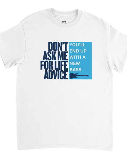 Flat-lay of Life Advice guitar tee styled with guitar pick, vinyl, and amp
