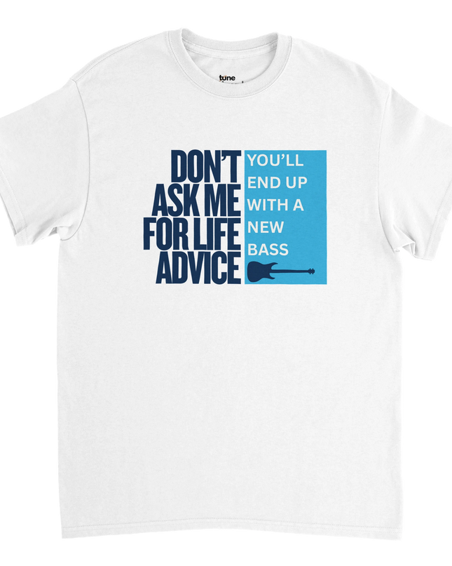 Flat-lay of Life Advice guitar tee styled with guitar pick, vinyl, and amp