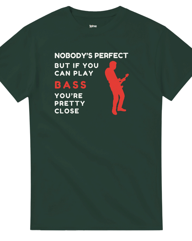 Flat‑lay of bass pun T‑shirt with headphones and guitar pick props