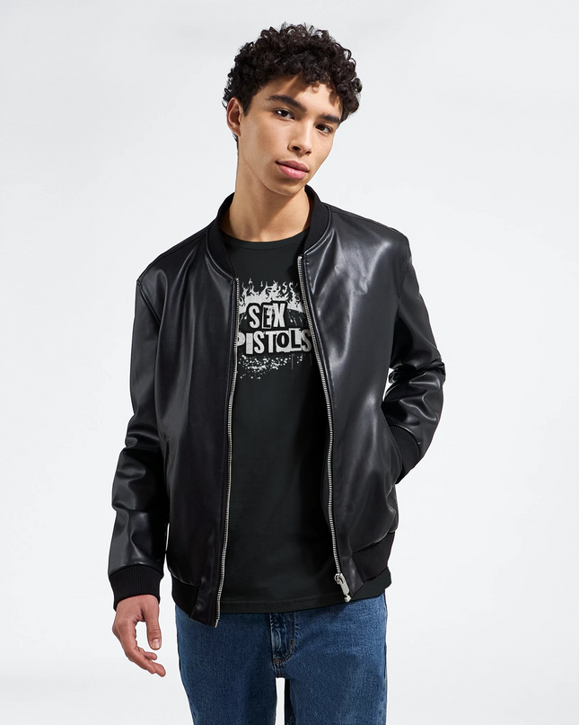Close-up of distressed Sex Pistols text design on shirt